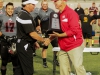 November 22, 2014 |Palomar Athletic Director Scott Cathcart presents Palomar Head Football Coach Joe Early with the Patriotic bowl trophy. The Comets defeated the Vaqueros 30-22 and win the Patriotic Bowl at Escondido HS, in Escondido California.| Photo Credit: Philip Farry | The Telescope