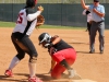 Sophomore third baseman Iesha Hill preps to throw the ball after tagging the Imperial Valley opponent at third base in the top of the fifth inning. In the end the Comets won the game 15-6 on April15. Michaela Sanderson/The Telescope