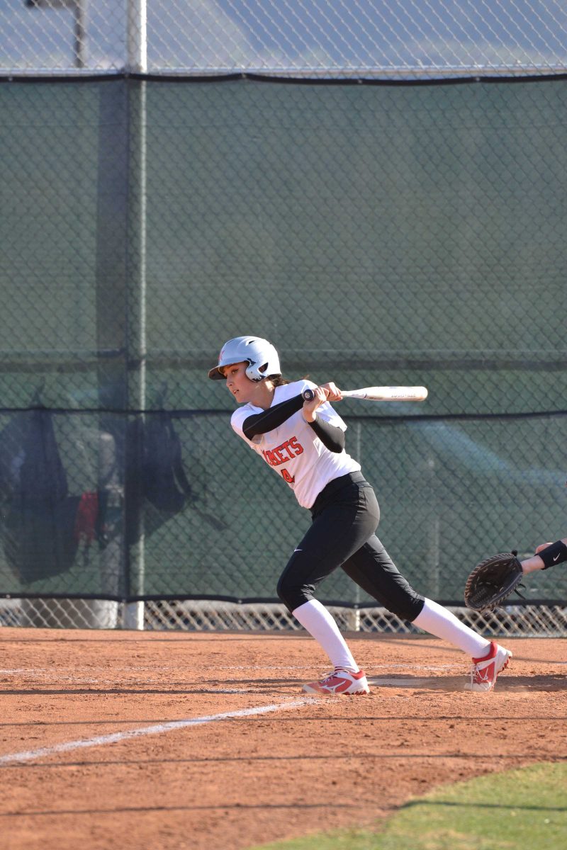 Jordan Ladner hits the ball for a double in the top of the third inning. Feb. 26, 2018. (Krista Moore/The Telescope)