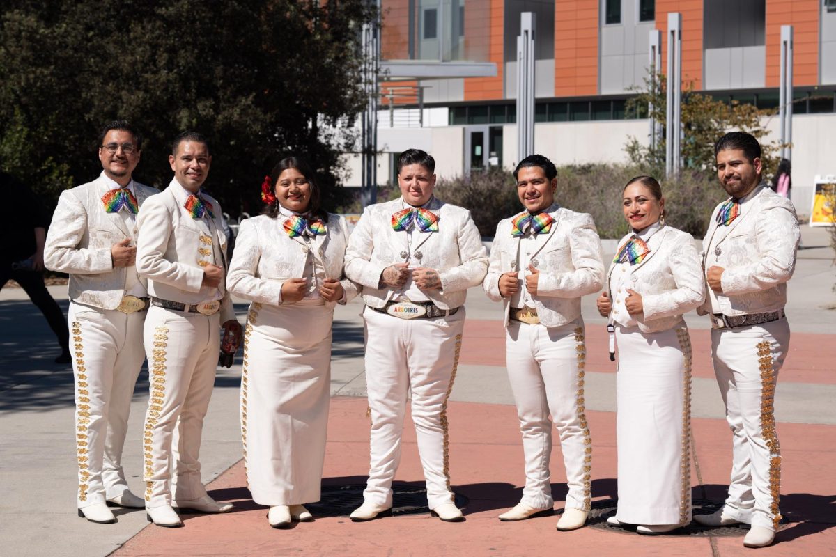 Mariachi Arco-Iris de Los Angeles pose for a group photo after their performance in front of the student union on October 10.