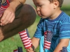A boy, Leonardo Chavez, setting American flags on the lawn at 9/11 Remembrance event hosted by the Office of Student Affairs at Palomar College Sept. 11, 2014. Photo: Yoshikazu Yamashita | The Telescope