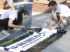 Sept. 12 | Ashley Fisher (left), president of active minds, and Brandon Doman (right) get the banner ready for the Send Silence Packing event at Palomar College | Guillermo Escamilla/ Telescope