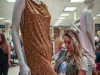 Priscilla Ventura adjusts the outfit on a mannequin for the student exhibit at the library on Nov. 18, 2014. Photo: Yoshikazu Yamashita | The Telescope