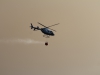 A Sheriff helecoptor assists fire fighters fighting the San Marcos Fire on Wednesday. Joe Davis / The Telescope