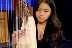 Therese Niguidula performs on harp during the HarpWaves concert at Palomar College’s free Concert Hour series in the Performance Lab on March 5.