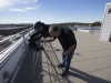 Professor Mark Lane views the eclipse through the telescope on Oct. 23, 2014 on the roof of the NS building. Photo: Paul Nelson | The Telescope