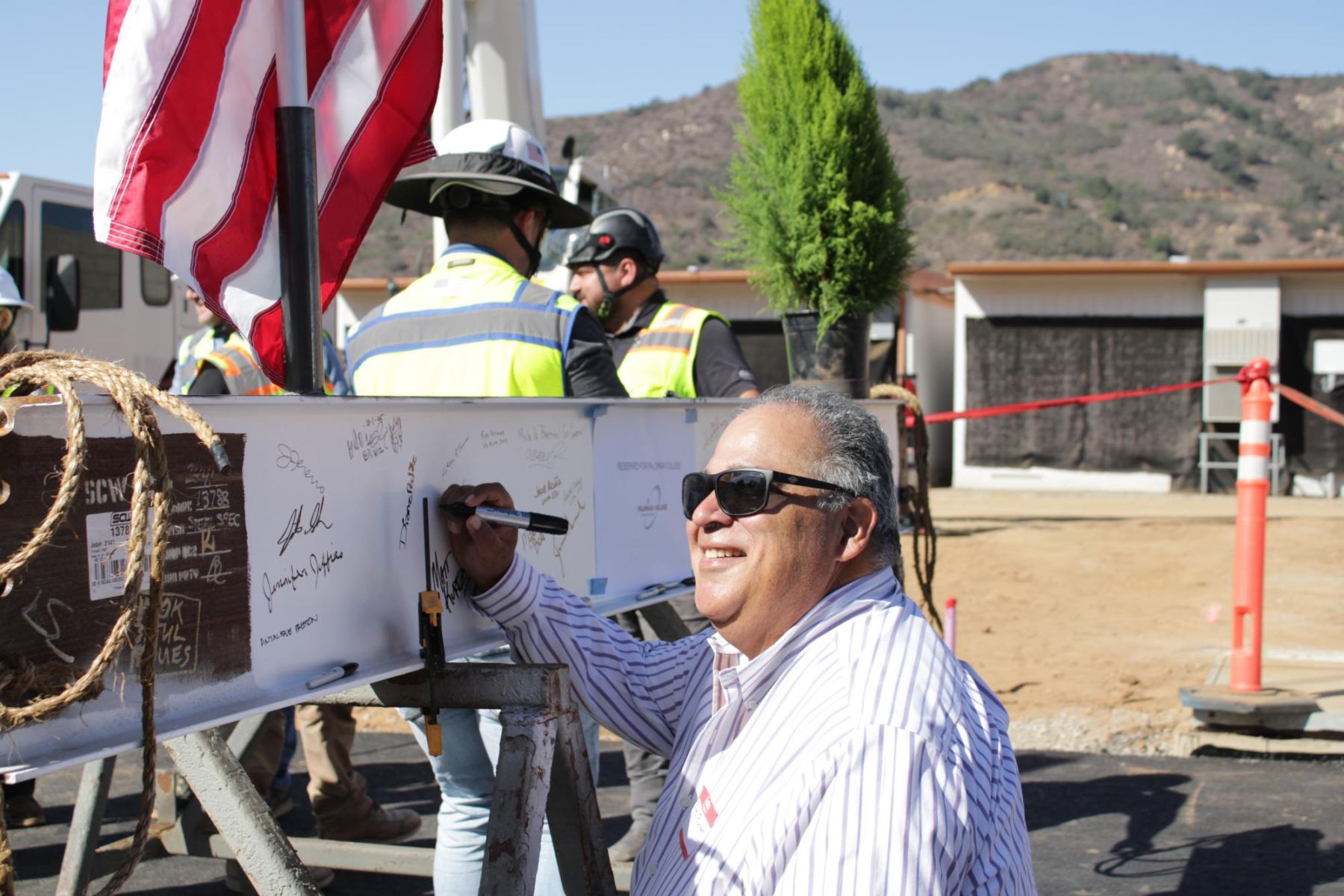 Governing Board Trustee Roberto Rodriguez poses for a photo as he signs the beam at the beam signing ceremony at Palomar's Fallbrook campus on Oct.1.