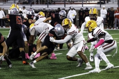 Palomar College running back Chris Bausch (#21) pushes past Saddleback College defensive back Jaden Humphrey (#29) and linebacker Orlando Gonzalez (#34) on Oct 25 2025 at the Palomar College Stadium.