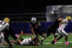 Palomar College running back Logan Cella (#28) is running past Saddleback College Iosefa Tapeni (#55)  during the third quarter on Oct 25 2025 at the Palomar College Stadium.
