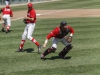 Palomar’s Vince Mori (18) runs back to cover third base as Pitcher Jake Barnett(center) watches catcher Francis Christy (far right) pick up a bunt in order to throw out an Orange Coast College batter. The Pirates defeated the Comets 3-0 at Euless Park in Fresno on May 24. Philip Farry / The Telescope