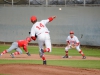 Palomar pitcher Adam Burciaga (#14) throws to first in attempts to get the out against the College of the Desert on Feb. 19 at Myers Field. Seth Jones/The Telescope