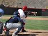 Palomar second baseman Mitch Gallagher {20) lays a bunt down the first base line and is able to make it on base. He would later advance through all the bases and score a run for the Comets who went on to win 9-3 March 25 vs. San Diego Mesa. Aaron Fortin/ The Telescope