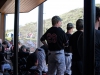 Players watching the winning game against Orange Coast from the dugout Feb. 9 at the Palomar College Ballpark. Olivia Meers/The Telescope