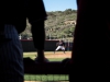 Palomar pitcher Mike Lopez pitching to Orange Coast as team watches from the dugout Feb. 9 at the Palomar College Ballpark. Olivia Meers/The Telescope