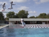 Three of Palomar's players take the plunge into the Wallace Memorial Pool after sweeping visiting Saddleback College 17 May at Myers Field. With the win the Comets advanced to the final four to be held in Fresno next weekend. Philip Farry / The Telescope