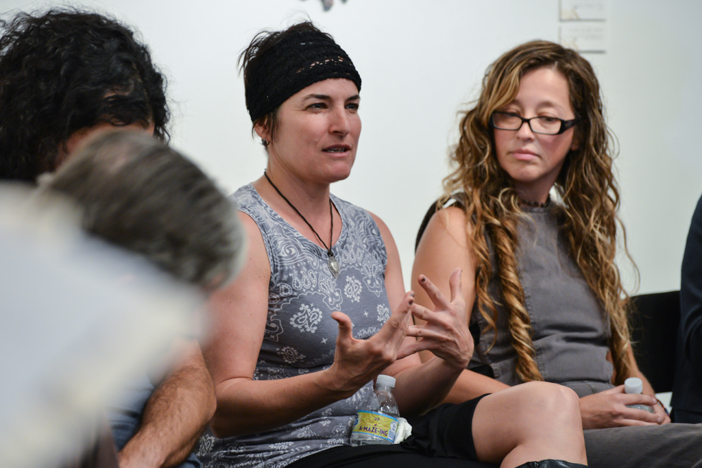 Iana Quesnell (center) describes her process in creating her graphite works, Marisol Rendon (right) listens during the artists panel discussion for the recent show “Sharp Contrast”, a drawing studying, at Palomar College, Tuesday Sept. 22, 2015. Quesnell goes into detail about her drawings and the involvement of her family history, she has two large scale pieces in the show as well as a video installation that shows the movement in working at the register of Trader Joes. Brandy Sebastian/The Telescope