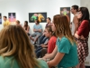 Samantha Bohl (center), Lauryn Allen (center left) and Maxinne Hernandez-Evans (far right) sit in for the “Sharp Contrast” panel discussion at Boehm Gallery, Palomar College, Tuesday Sept. 15. Bohl, Allen and Evans along with the majority of their Methods and Materials class bring their own stools to sit in on the discussion. The class is taught by Ingram Ober (not seen), who also lead the panel discussion. Brandy Sebastian/The Telescope