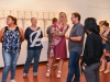 Ingram Ober (second from right), gallery director and Palomar professor, discusses show works and technique at the group exhibition “Sharp Contrast” at the Boehm Gallery, Palomar College, Thursday, Sept. 10, 2015. Claudia Castillo and Shawn Vander-Ploeg (left to right), Palomar students, listen on while Ober speaks with Lily Glass (third from left), Department Chair of the Art Department, and Sarah Lanting (far right), ASL interpreter at Palomar. Brandy Sebastian/The Telescope