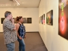 Robert Nelson (left) discusses his thought process with Palomar Student Claudia (right) Castillo during the group exhibition “Sharp Contrast” at the Boehm Gallery, Palomar College, Thursday, Sept. 10, 2015. Nelson has ten pieces in the show and is one of the few artist that displays bold saturated juxtaposed colors. Brandy Sebastian/The Telescope