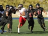 Palomar’s Robert Ursua (80) eludes five Santa Ana College defenders and gains 24 yards on the play. The Comets defeated the Dons 37-27 at Santa Ana Stadium in Santa Ana on Nov 14. The win improved the Comets record to 4-6 (2-4 in the Southern Conference). Philip Farry / The Telescope