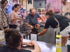 Yesenia Gonzalez (left center) and Clauduia Castillo (right center) assist Michael Hernandez, professor (center), during a demonstration for Glass Blowing 3 for the T-Th 8 a.m. class at Palomar on Tuesday Sept. 15. Gonzalez and Castillo use water soaked paddles to help prevent burns to the arm and hand of Hernandez during shaping of the hand blown piece. While students Alexis Valdillez (far left), Carey Pickford (far right) and Logan Groupe’ (front left) watch closely. Brandy Sebastian/The Telescope