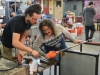 Logan Groupe’ (left) assists Mark Lessard (right) during the shaping of a hand blown piece for the T-Th, 8 a.m. class at Palomar on Tuesday Sept. 15. Groupe’ uses a caliper to aid Lessard in sculpting his work. Brandy Sebastian/The Telescope