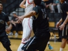 Palomar forward Matt Duniphan (21) passes the ball under the basket as Citrus College forward Ryan Wiley #23 attempts to stop him during the First Round Southern Regional Playoff game on Feb. 24 at the Dome. Citrus College won 77-63. Tracy Grassel/The Telescope