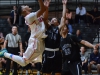 Palomar College guard Deven Riley (20) shoots over Citrus College guard Donn-Christian Corbin (14) during the First Round Southern Regional Playoff game on Feb. 24 at the Dome. Citrus College won 77-63. Tracy Grassel/The Telescope