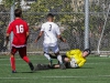 Palomar goalkeeper Autry Hailey makes a save during the first half against San Diego City College’s Rafael Lopez (3) as Palomar’s Stone McElderry (16) watches. The Comets beat the Knights 3-1 at Minkoff Field Oct 13. Philip Farry / The Telescope