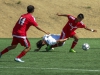 Palomar midfielder Lalo Vasquez (7) is tripped by San Diego City College’s Cyrus Huxford (7) as Palomar’s Juan Garcia (14) watches during the first half. The Comets beat the Knights 3-1 at Minkoff Field Oct 13. Philip Farry / The Telescope