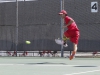 Palomar’s Taylor Bryant hits the ball between his legs during the second set against College of the Deserts David Bensoussan (not pictured) on March 19. Bensoussan defeated Bryant 6-2, 6-4. Philip Farry / The Telescope