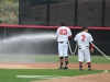 Palomar infielders Niko Holm and Effrin Medina hose down the field before the grand opening game against College of the Desert on Jan. 27. Michaela Sanderson/TheTelescope