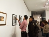 (l-R) David Sanchez and Victor F Chazez l look through the many art pieces on display and stops to discuss a photograph by Melinda Finn at the Annual Faculty Exhibition at the Boehm Gallery, Palomar College Dec. 2; 2015. Patty Hayton/The Telescope