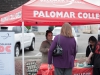 Palomar College Communications Assistant Dianna Trujillo (left) speaks with a festival goer at the 24th Annual San Marcos Spring Festival on April 10 in San Marcos. Palomar College's NCEOC and the Dance Team were also on hand at the festival. Stephen Davis/The Telescope