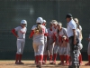 The Palomar's Softball team waits for Kali Pugh (23) to come in to home base after hitting her second home run during the second home game of the double header against Cypress College, April 11th. The Comets lost their first game 5-2, but came back and won their second game 3-2 thanks to the two home runs from Pugh. Dirk Callum / The Telescope