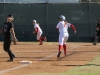 Palomar's Brooke Huddleson hits a home run agaisnt Mt. San Antonio, allowing Keilani "K.K." Fronda and Kali Pugh (not seen) add a total of 3 points to the scoreboard for Palomar in the bottom of the third inning April 4. Palomar had previously beaten Santiago Canyon College during their first double header game 5-2, and came out on top of Mt. San Antonio 4-1. Dirk Callum/The Telescope