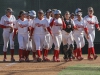 The Palomar Women's Softball team wait at home base for team-mate Brooke Huddleson (4) to congratulate her on the home run hit that resulted in 3 points for Palomar agaisnt Mt. San Antonio, April 4. Palomar had previously beaten Santiago Canyon College during their first double header game 5-2, and came out on top of Mt. San Antonio 4-1. Dirk Callum/The Telescope