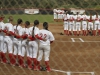 The Comets softball team takes the field during the playing of the National Anthem March 11. Philip Farry / The Telescope