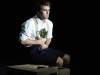 Riley Fisher as Melchior clutches a bouquet of flowers to his breast in the dress rehearsal of the musical Spring Awakening on Feb. 24. Christopher Jones/The Telescope