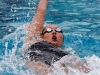 Palomar's Michelle Jacob swims the 100-yard backstroke during the meet against Grossmont at the Wallace Memorial Pool on April 8. Jacob placed first with a time of 1.03.32. Coleen Burnham/The Telescope