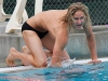 Palomar's Paul Schaner count laps for teammate Andrew Bertotti who is in the pool swimming the men's 500-yard freestyle. Palomar swam against Grossmont at the Wallace Memorial Pool on April 8. Bertotti placed first with a time of 5.13.28. Coleen Burnham/The Telescope