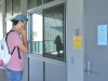 Palomar student Cody Rivara contemplates what step to take next on his first day of class when reading the sick notice from his professor. MD Buliding, Aug. 18. 2015 Brandy Sebastian/The Telescope