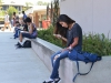 Palomar incoming freshman Crystal Diaz, 18, radiology major, escapes the summer heat in the shadows of the Humanities building while waiting for her English 50 class Aug. 19, 2015 Brandy Sebastian/The Telescope