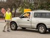 Shawn McCann directs traffic in Parking Lot 12 during the first week at Palomar College. He said, "Many drivers ignore my directions and try to find a spot closer to their class. They end up coming back here." Justin Gray/The Telescope