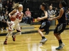 Palomar's Cheyenne Ertz (24) gets ready to pass the ball during the women's basketball game against Mira Costa at the Dome on Jan. 27. Mira Costa players Jessica Ramirez (left) and Alynne Nguyen (right) attempt to defend. The Comets won 83-34. Coleen Burnham/The Telescope