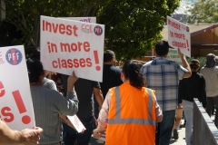 Attendees marching alongside the Student Union on March, 12, 2026 at Palomar College, holding signs that request more investment in classes.