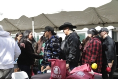 The Final Bird Singer Group shakes hands with community members after their performance