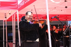 Ricardo Arzola, the violinist, is performing with the rest of the Mariachi band outside the student union building. Photo credit: Griselda Garcia