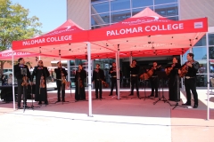 From Left to right, Ricardo Arzola, Yalitza Vásquez-Lopez, Carlos Samaniego, Melisa Diaz, Edwin Martinez, Brian Espinoza, Noel Ayala-Loera, Sammi Bautista, Pat Fernandez, and Ricardo Dollero are part of the  Mariachi Arco-Iris de Los Angeles. They played at Palomar's Pride Center 15 year anniversary event. Photo credit: Griselda Garcia