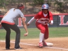 Palomar head softball coach Lacey Craft signals to outfielder Keilani âKKâ Fronda to tag up from third base on Carlie Danielâs sacrifice fly in the 1st inning against Imperial Valley College on April 23 at Palomarâs softball field. Fronda hit for the cycle with 2 homeruns, a triple, double, single, and 8 RBIâs in the Cometâs 25-0 win over the Arabs. The win gave the Cometâs a perfect 18-0 conference record for the first time since 2005. Scott Colson/The Telescope